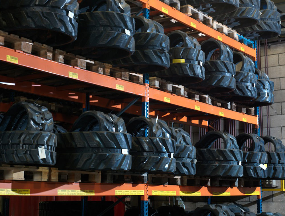 Stacks of excavator tracks