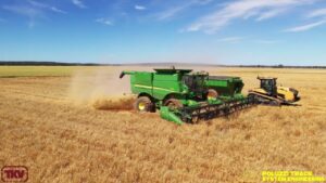 John Deere S670 wearing Poluzzi Bolt on Tracks